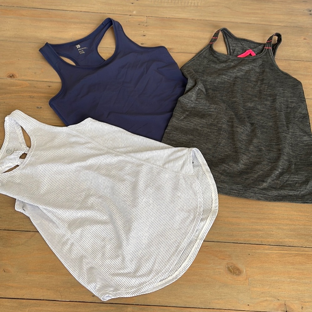 Three sport tanks . Cool fabrics selling all together for list price